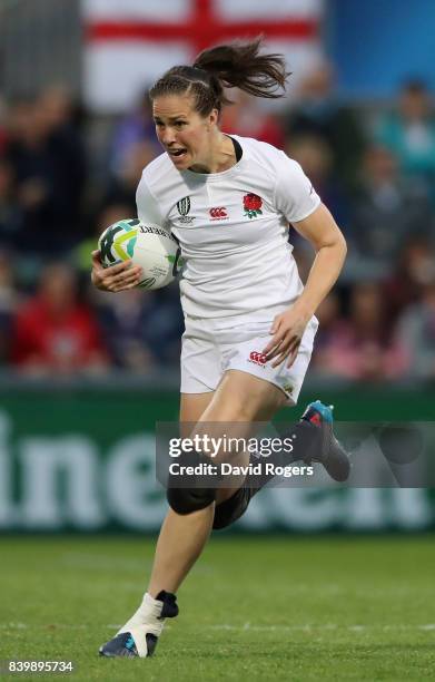 Emily Scarratt of England runs with the ball during the Women's Rugby World Cup 2017 Final betwen England and New Zealand at the Kingspan Stadium on...