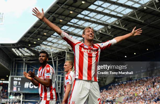 Peter Crouch of Stoke City celebrates scoring the equalising goal during the Premier League match between West Bromwich Albion and Stoke City at The...