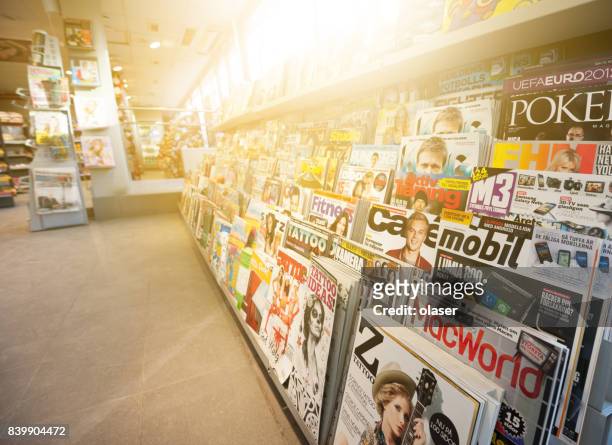 swedish news stand, mixed magazines - banca de jornais imagens e fotografias de stock