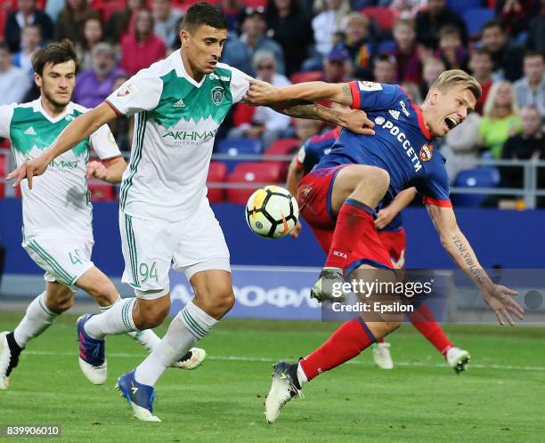 Pontus Wernbloom of PFC CSKA Moscow vies for the ball with Philipe Sampaio n of FC Akhmat Grozny during the Russian Premier League match between PFC...