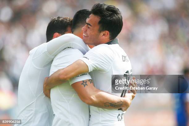 Esteban Paredes of Colo-Colo celebrates with teammates after scoring the third goal of his team during a match between Colo-Colo and U de Chile as...