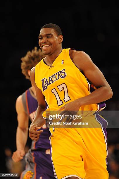 Andrew Bynum of the Los Angeles Lakers smiles while running up the court during the game against the Phoenix Suns at Staples Center on December 10,...