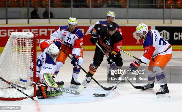 Stephen Dixon of Wolfsburg fails to socre over Dominik Hrachovina, goaltender of Tampere during the Champions Hockey League match between Grizzlys...