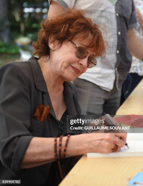 French writer and actress Marlene Jobert signs book a during the 22th La Foret Des Livres book fair on August 27, 2017 in Chanceaux-pres-Loches,...