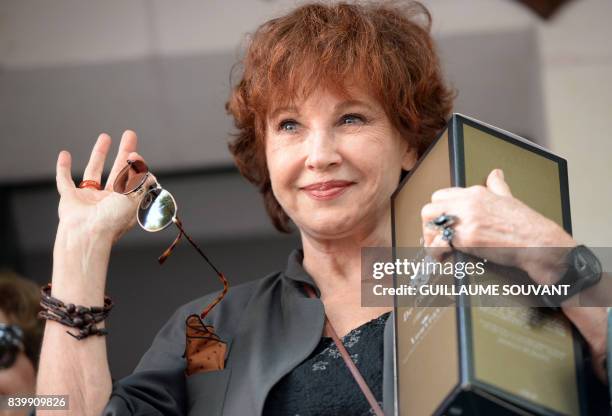 French writer and actress Marlene Jobert waves during the 22th La Foret Des Livres book fair on August 27, 2017 in Chanceaux-pres-Loches, central...