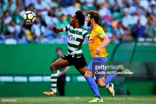 Sporting's forward Gelson Martins vies with Estoril's defender Joel Ferreira during the Portuguese league football match Sporting CP vs Estoril Praia...