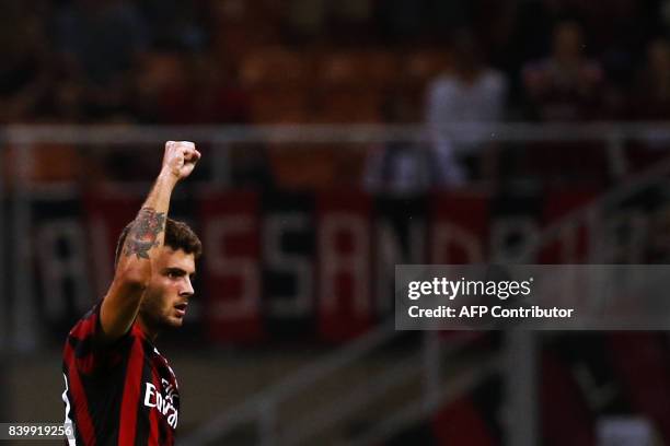 Milan's forward Patrick Cutrone celebrates after scoring during the Italian Serie A football match AC Milan Vs Cagliari on August 27, 2017 at the...