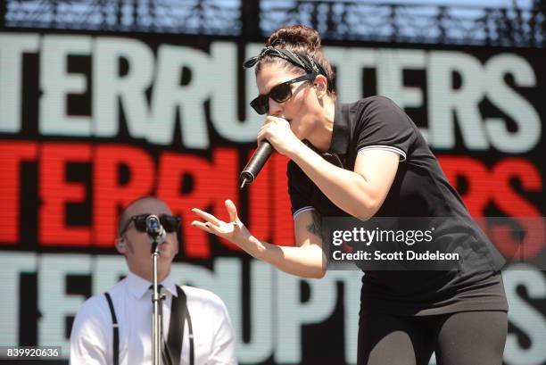 Musicians Kevin Bivona and Aimee Allen of the band The Interrupters perform onstage during the Its Not Dead 2 Festival at Glen Helen Amphitheatre on...
