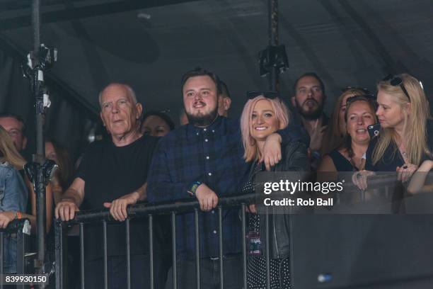 John Bradley-West from Game of Thrones watches Liam Gallagher perform at Reading Festival at Richfield Avenue on August 27, 2017 in Reading, England.