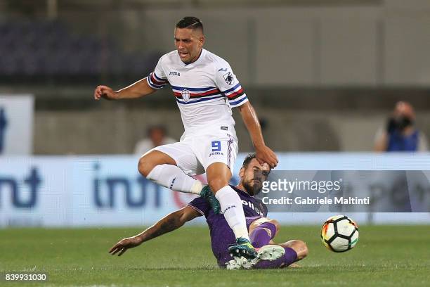 Nenad Tomovic of ACF Fiorentina battles for the ball with Gianluca Caprari of UC Sampdoria during the Serie A match between ACF Fiorentina and UC...