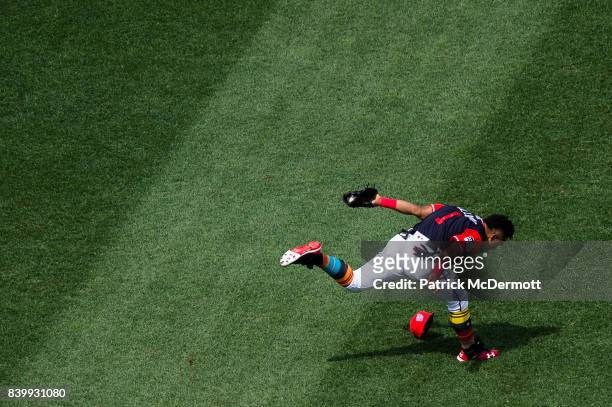 Wilmer Difo of the Washington Nationals is unable to make a play on an infield single hit by Juan Lagares of the New York Mets in the fifth inning...