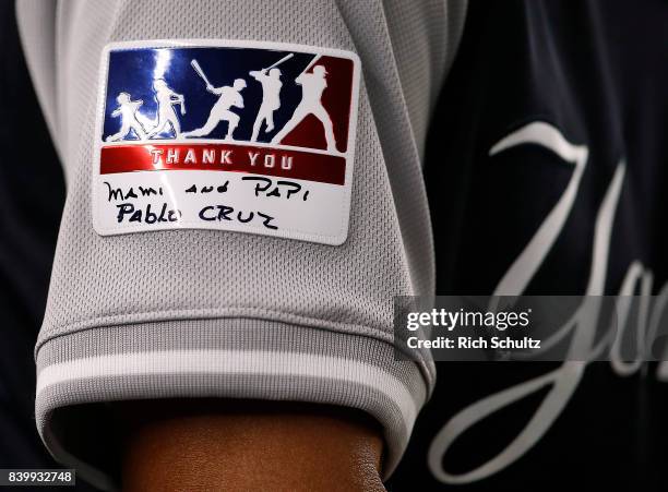 Thank you patch worn by all players with hand written messages as worn by first base coach Tony Pena of the New York Yankees during a game against...