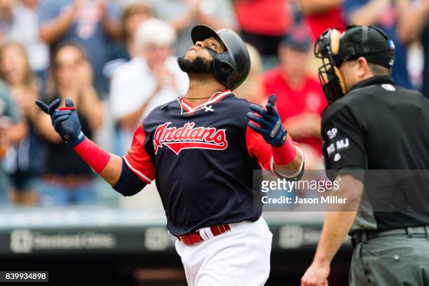 Carlos Santana of the Cleveland Indians celebrates after hitting a three run home run during the second inning against the Kansas City Royals at...