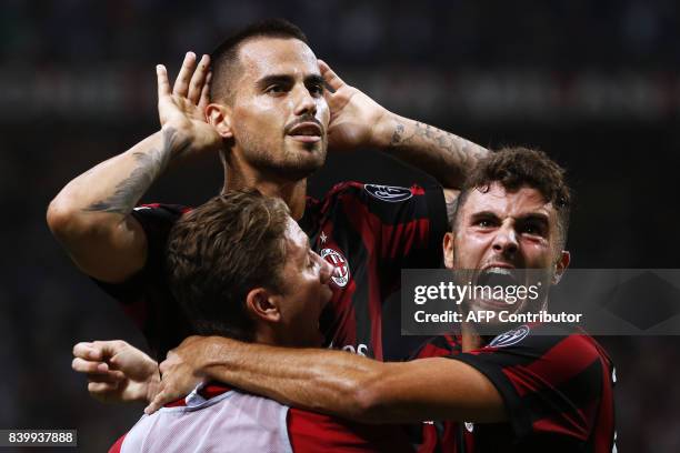 Milan's midfielder Suso from Spain celebrates after scoring with his teammate AC Milan's forward Patrick Cutrone during the Italian Serie A football...