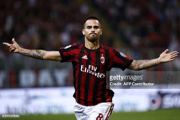 Milan's midfielder Suso from Spain celebrates after scoring during the Italian Serie A football match AC Milan Vs Cagliari on August 27, 2017 at the...