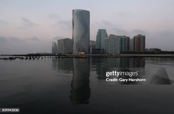 The new Ellipse residential tower next to the Hudson River in the Newport neighbourhood of Jersey City, New Jersey is seen at sunrise on August 16...