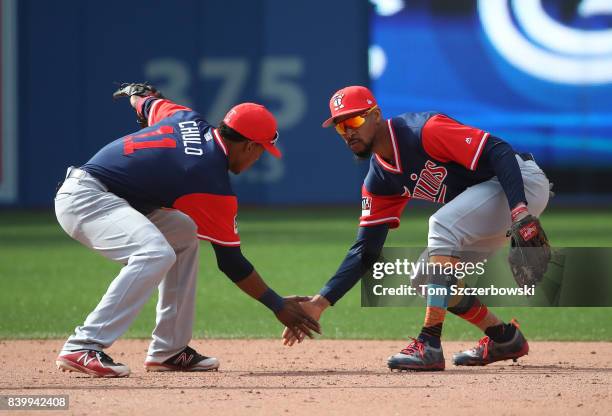 Byron Buxton of the Minnesota Twins celebrates their victory with Jorge Polanco during MLB game action against the Toronto Blue Jays at Rogers Centre...