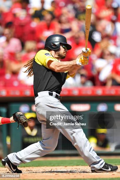 John Jaso of the Pittsburgh Pirates hits a two-run double in the fourth inning against the Cincinnati Reds at Great American Ball Park on August 27,...