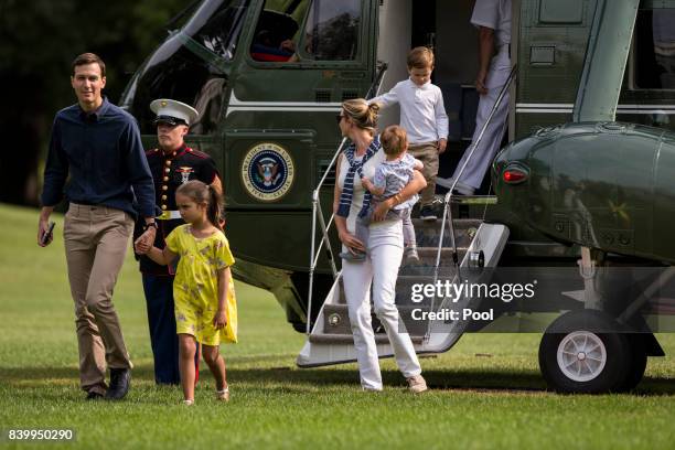 Special Advisors Jared Kushner and Ivanka Trump with their children, Arabella Joseph and Theodore, 1 exit Marine One on the South Lawn August 27,...