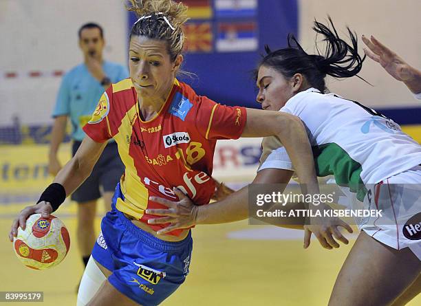 Spanish Begona Fernandez is pushed by Hungarian Orsolya Verten during the 8th Women's Handball European Championships match on December 11, 2008 in...