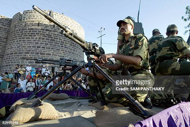 Indian Border Security Force solders stand guard during the innauguration of the Rann Ustav 2008 cultural festival in Bhuj on December 11, 2008. The...