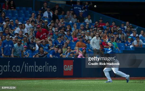 Toronto Blue Jays left fielder Steve Pearce chases down a fly ball for an out. Toronto Blue Jays Vs Minnesota Twins in MLB regular season play at...
