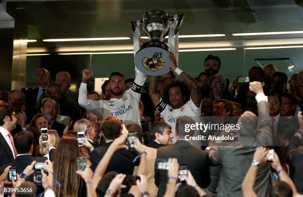 Sergio Ramos and Marcelo of Real Madrid pose for a photo with their 2016/2017 La Liga trophy ahead of the La Liga soccer match between Real Madrid...