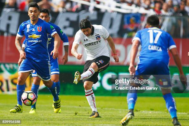Jaime Valdes of Colo Colo kicks the ball to score the second goal of his team during a match between Colo-Colo and U de Chile as part of Torneo...