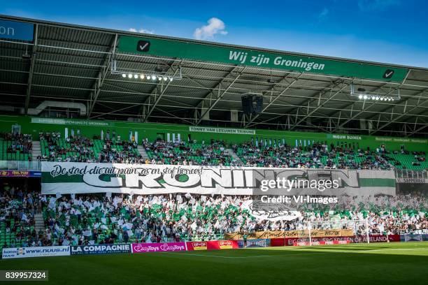 Banner de stad die uit puin as en stof herrees during the Dutch Eredivisie match between FC Groningen and FC Utrecht at Noordlease stadium on August...