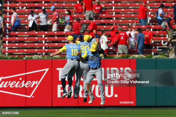 Peter Bourjos, Steven Souza Jr. #20 and Kevin Kiermaier of the Tampa Bay Rays celebrate after beating the St. Louis Cardinals in 10 innings at Busch...