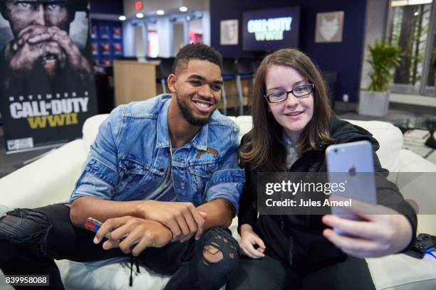 Karl-Anthony Towns and Ashley Glassel live stream "Call of Duty: WWII" beta on August 27, 2017 in Minneapolis, Minnesota.