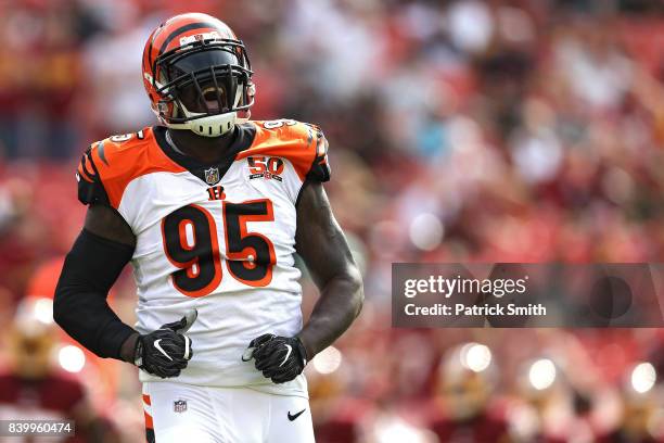 Wallace Gilberry of the Cincinnati Bengals reacts after sacking quarterback Kirk Cousins of the Washington Redskins in the first quarter during a...