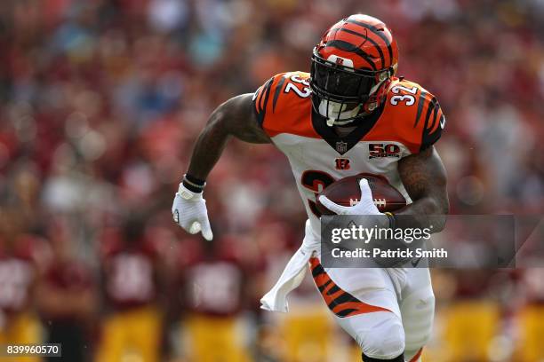 Running back Jeremy Hill of the Cincinnati Bengals rushes against the Washington Redskins in the first half during a preseason game at FedExField on...