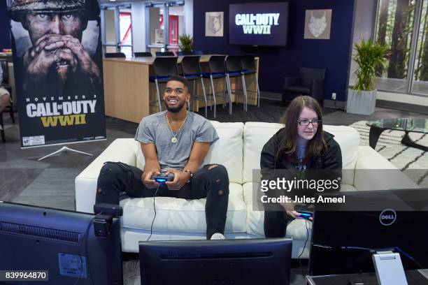 Karl-Anthony Towns and Ashley Glassel live stream "Call of Duty: WWII" beta on August 27, 2017 in Minneapolis, Minnesota.