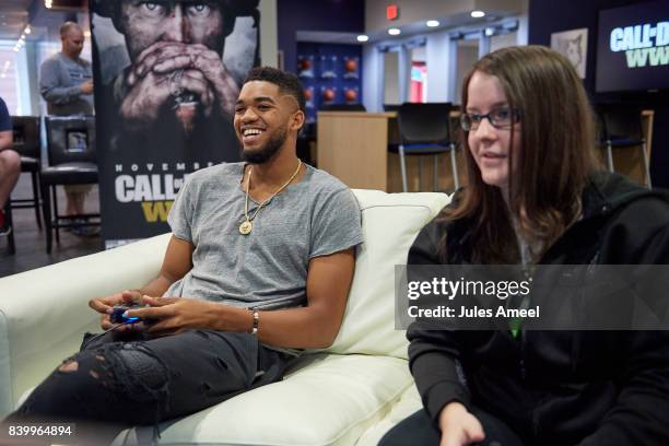 Karl-Anthony Towns and Ashley Glassel live stream "Call of Duty: WWII" beta on August 27, 2017 in Minneapolis, Minnesota.