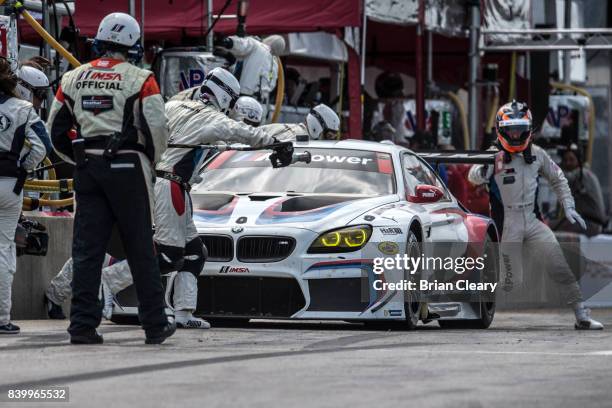 The BMW M6 GTLM of Bill Auberlen and Alexander Sims, of Great Britain, makes a pit stop during the Michelin GT Challenge WeatherTech SportsCar Series...