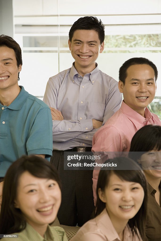 Portrait of a group of office workers smiling together