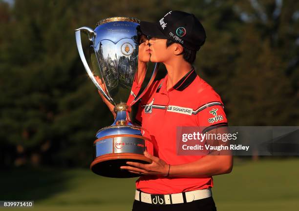 Sung Hyun Park of Korea celebrates with the trophy after winning the Canadian Pacific Women's Open following the final round at the Ottawa Hunt &...