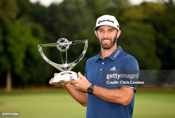 Dustin Johnson poses with the trophy after winning THE NORTHERN TRUST at Glen Oaks Club on August 27 in Old Westbury, New York.