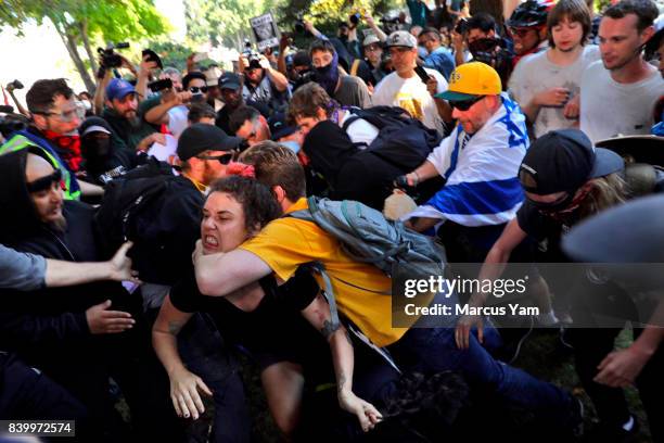 Fighting breaks out at Martin Luther King Park where counter protesters and Trump supporters clashed on August 27, 2017 in Berkeley, California.
