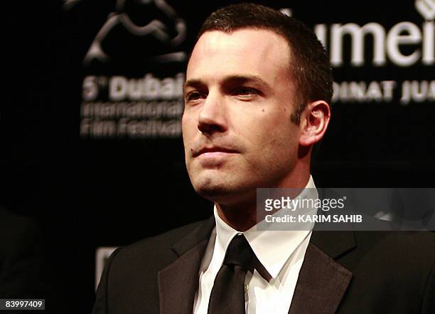 Actor Ben Affleck poses on the red carpet on the opening night of te fifth edition of the Dubai International Film Festival in Dubai on December 11,...