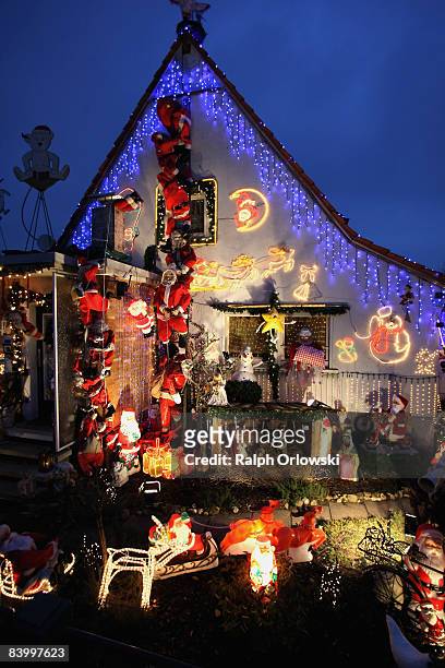 One family house, richly adorned with Christmas decoration stands illumilated on December 11, 2008 in Kelkheim near Frankfurt am Main, Germany. For...