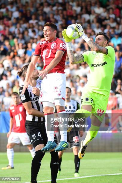 Goalkeeper Alexandre Letellier of Angers gathers the ball under pressure from Ezequiel Ponce of Lille during the Ligue 1 match between Angers SCO and...