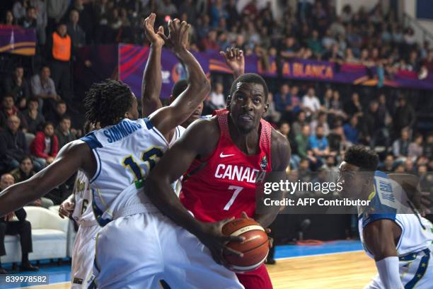 Canada's power forward Andrew Nicholson vies for the ball with Virgin Islands' shooting guard Jahmia Simmons during their 2017 FIBA Americas...