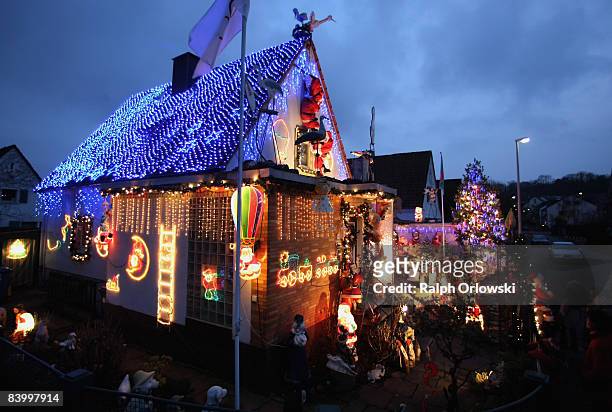 One family house, richly adorned with Christmas decoration stands illumilated on December 11, 2008 in Kelkheim near Frankfurt am Main, Germany. For...