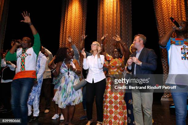 Minister of Culture Francoise Nyssen and French Secretary of State for Foreign Affairs Jean-Baptiste Lemoyne dance with dancers of Cote d'Ivoire...