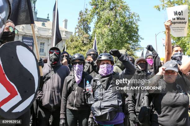 Antifa members and counter protesters gather during a rightwing No-To-Marxism rally on August 27, 2017 at Martin Luther King Jr. Park in Berkeley,...