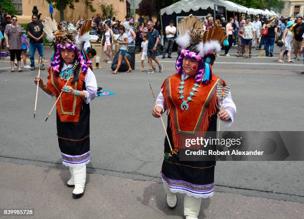 Young Native American members of the Edaakie Junior Dance Group from Zuni Pueblo near Gallup, New Mexico, perform at the Santa Fe Indian Market in...