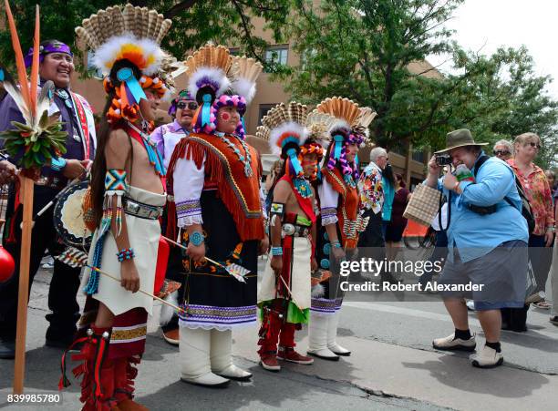 Young Native American members of the Edaakie Junior Dance Group from Zuni Pueblo near Gallup, New Mexico, pose for photographs at the Santa Fe Indian...
