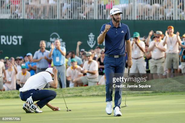 Dustin Johnson of the United States reacts after putting on the 18th green during the final round of The Northern Trust at Glen Oaks Club on August...